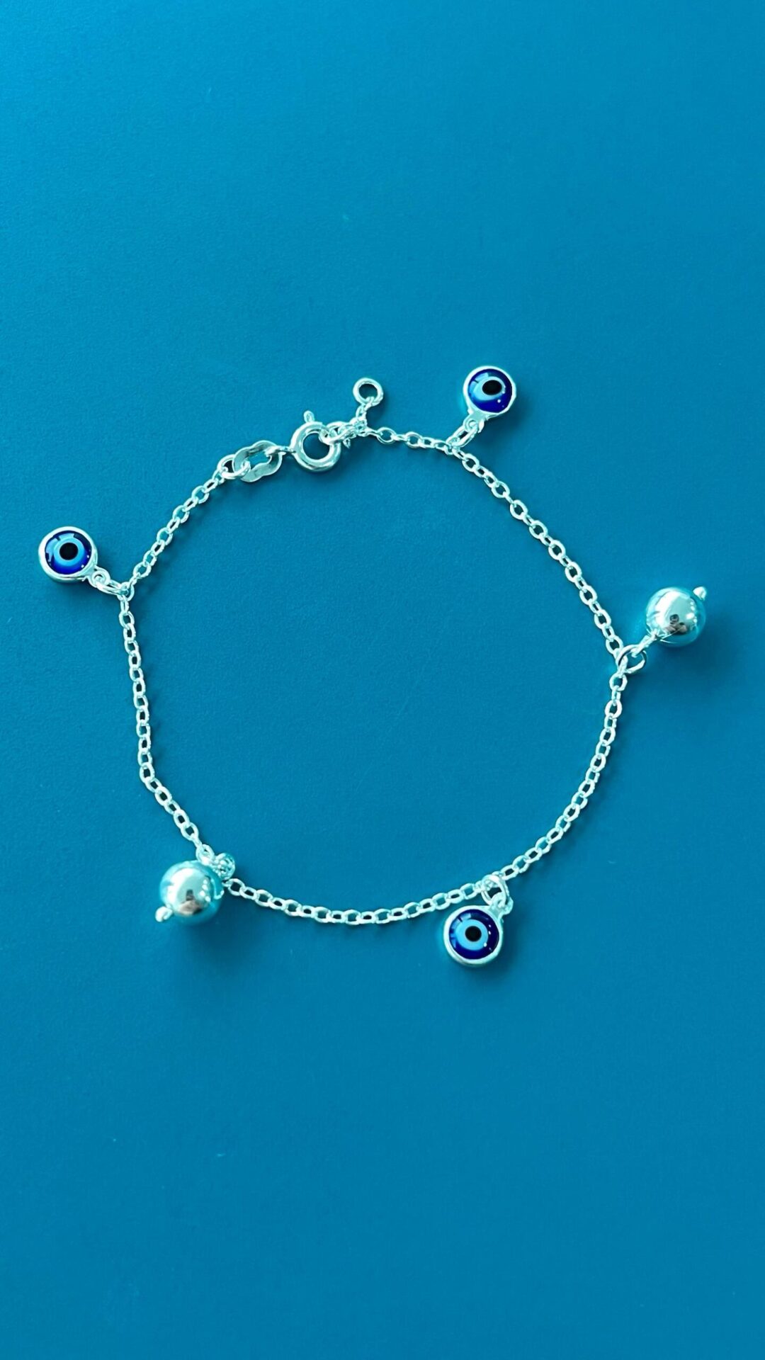 15252591741-whatsapp-image-2024-02-19-at-16-48-22.jpeg PULSEIRA OLHO GREGO COM BOLINHAS - PRATA 925