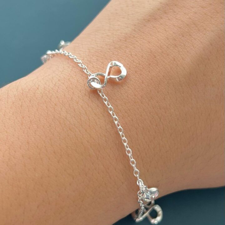 15252710272-whatsapp-image-2024-02-20-at-09-39-06-1-1.jpeg PULSEIRA INFINITO COM ZIRCÔNIA - PRATA 925